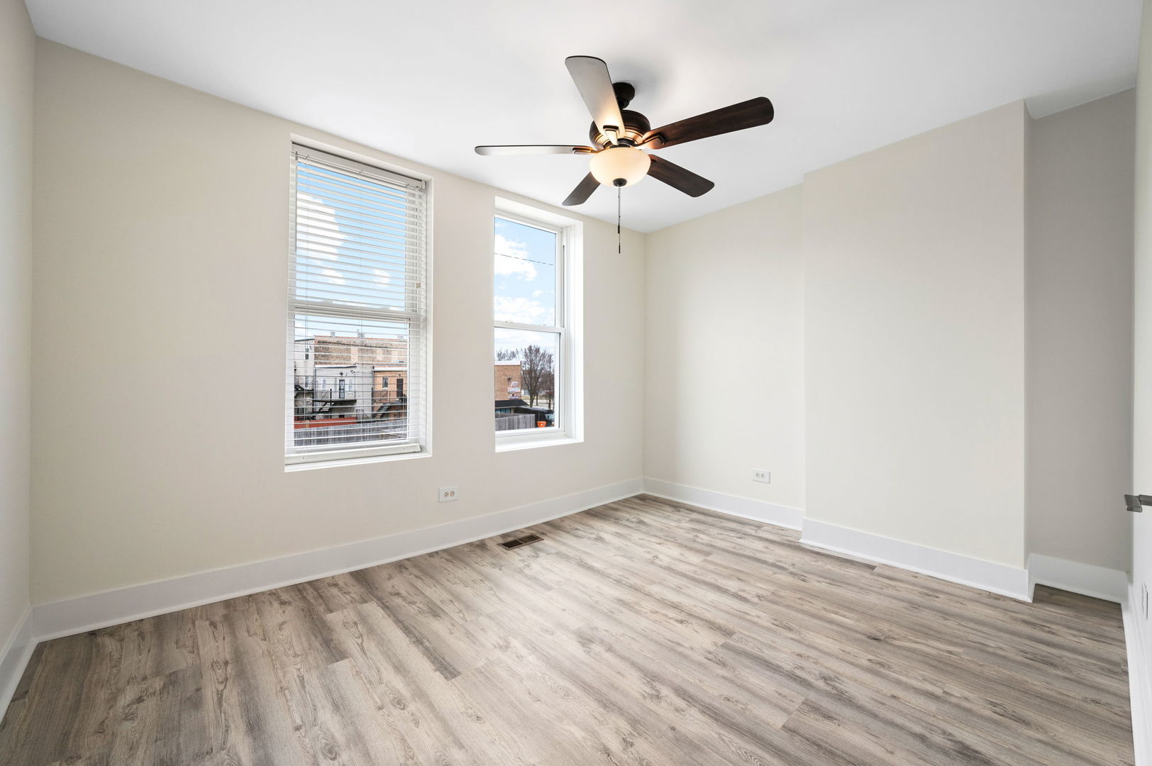 2756 West Monroe Street Chicago, IL 60612 - Photo 40 of 52 a view of an empty room with wooden floor and a window