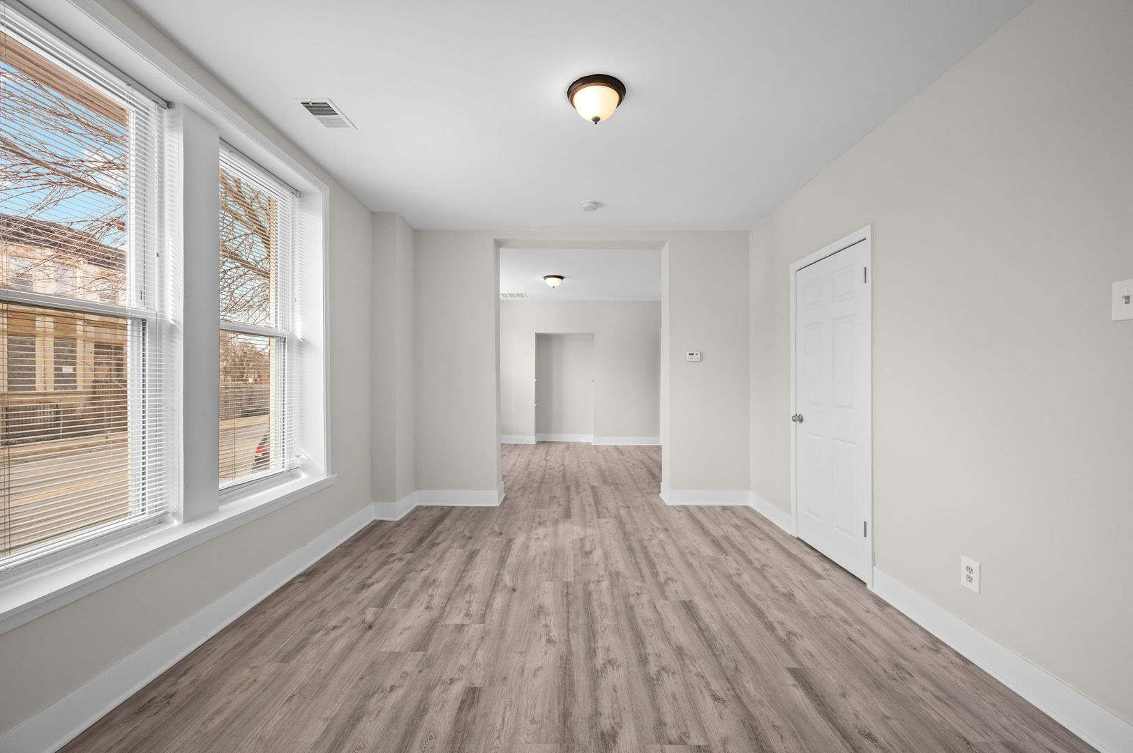 2756 West Monroe Street Chicago, IL 60612 - Photo 6 of 52 a view of empty room with wooden floor and fan