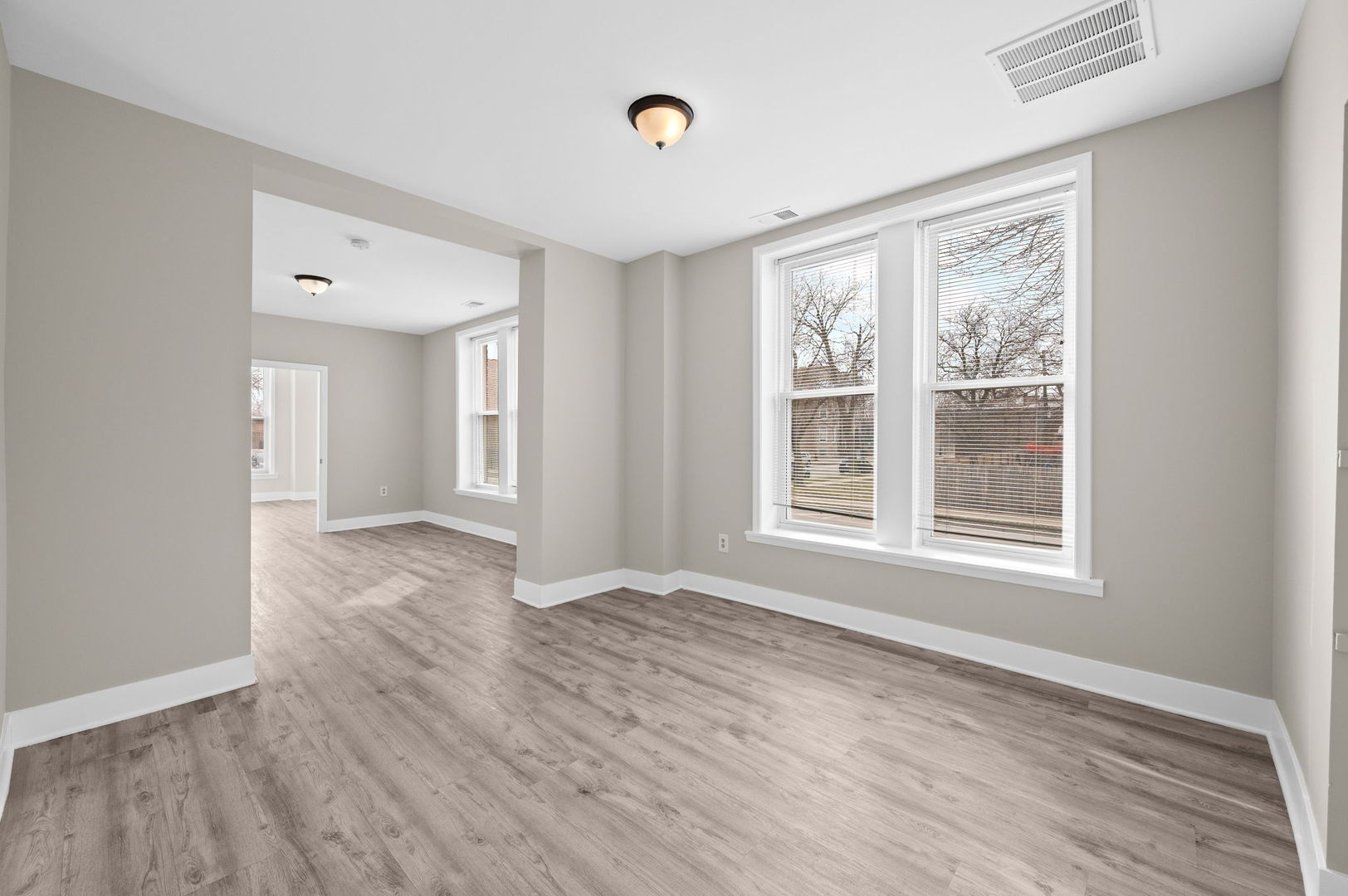 2756 West Monroe Street Chicago, IL 60612 - Photo 8 of 52 a view of an empty room with wooden floor and a window
