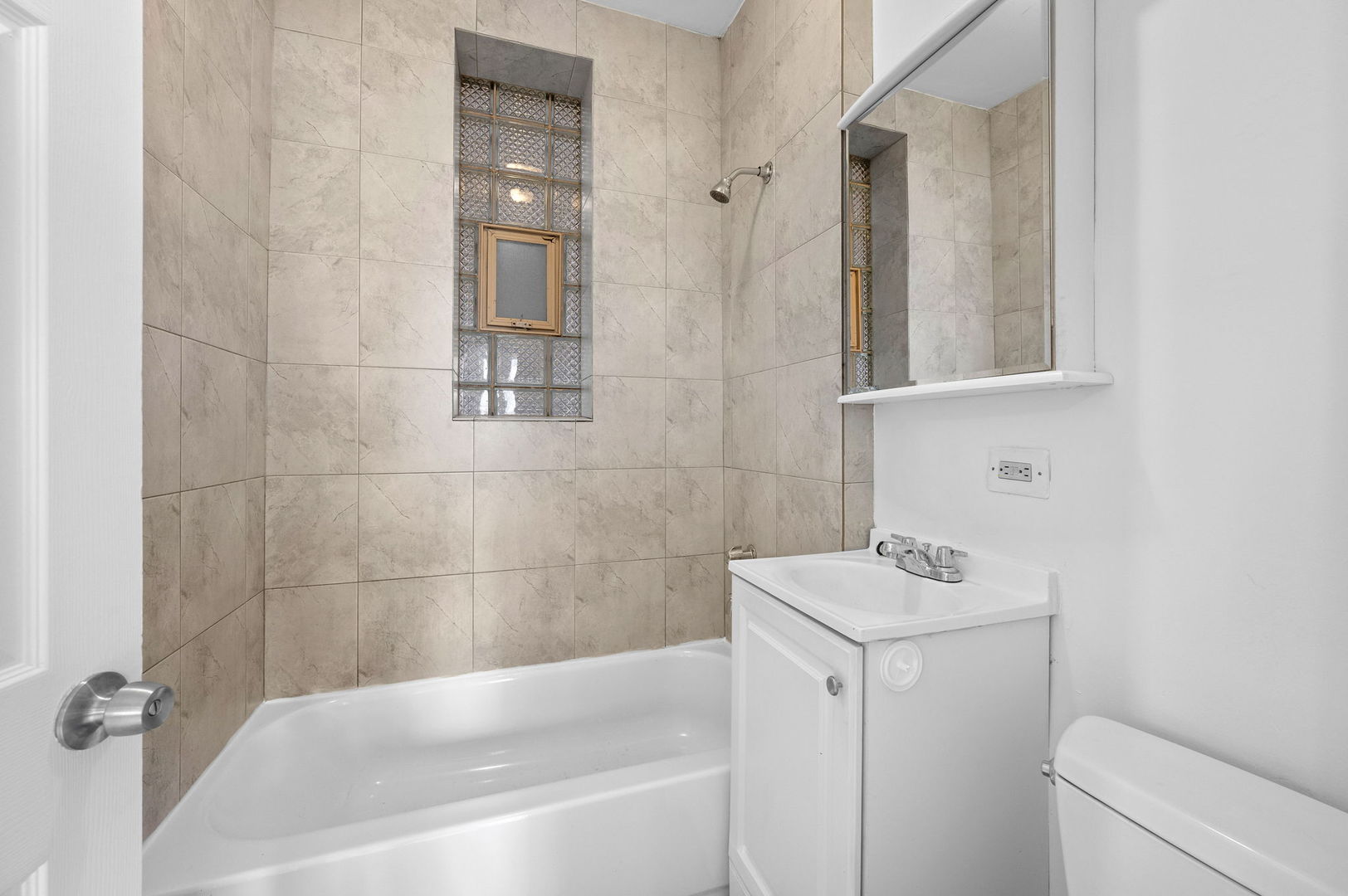 2756 West Monroe Street Chicago, IL 60612 - Photo 10 of 52 a bathroom with a sink a toilet and shower