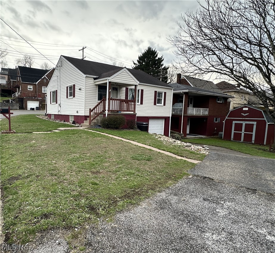 102 Beech Road Weirton, WV 26062 - Photo 21 of 23 Back of home featuring a garage, porch and yard