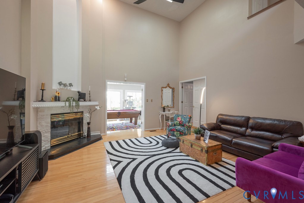 2602 Cox Road Henrico, VA 23233 - Photo 18 of 50 a living room with furniture fireplace and flat screen tv