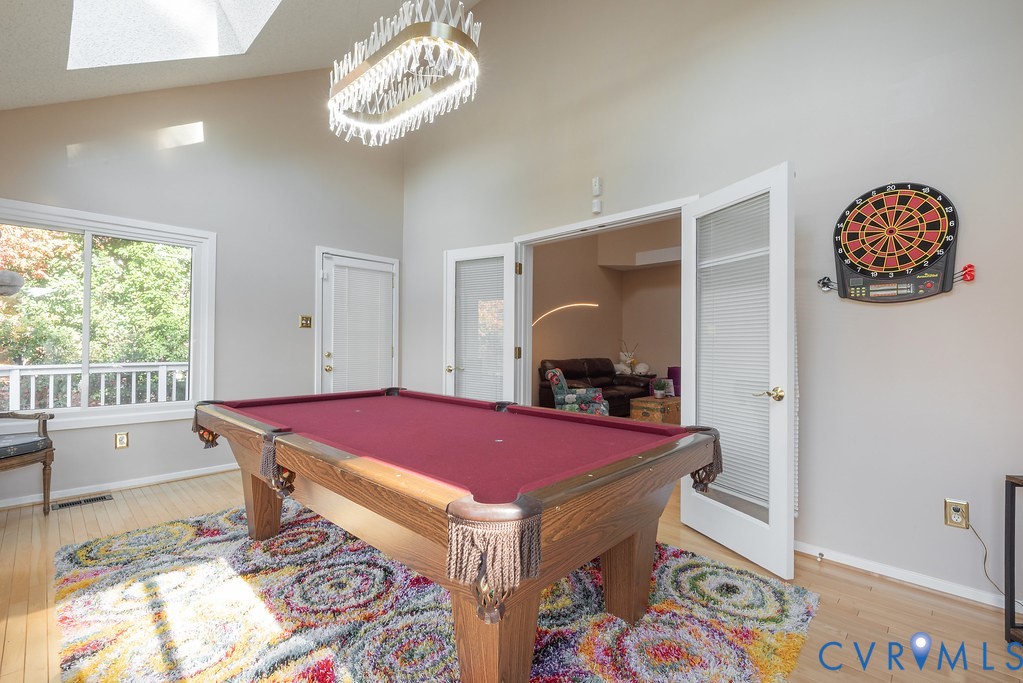 2602 Cox Road Henrico, VA 23233 - Photo 22 of 50 a dining room with a rug table and chairs