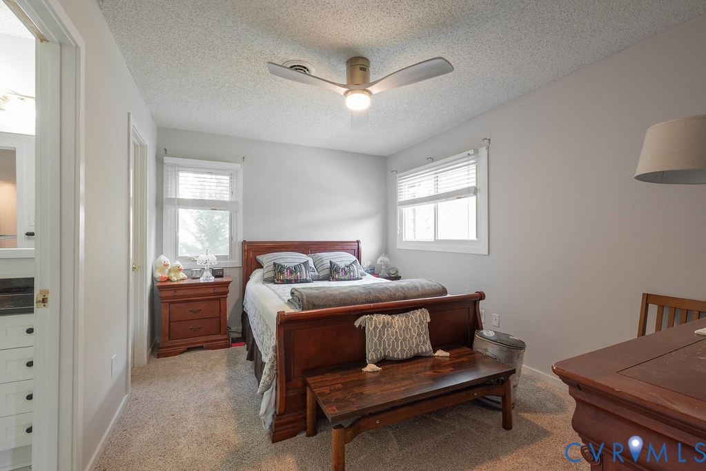 2602 Cox Road Henrico, VA 23233 - Photo 34 of 50 a bedroom with a bed and a dresser in it