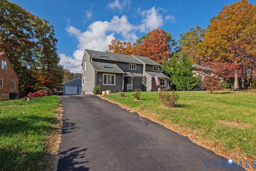 2602 Cox Road Henrico, VA 23233 - Photo 4 of 50 a front view of a house with garden
