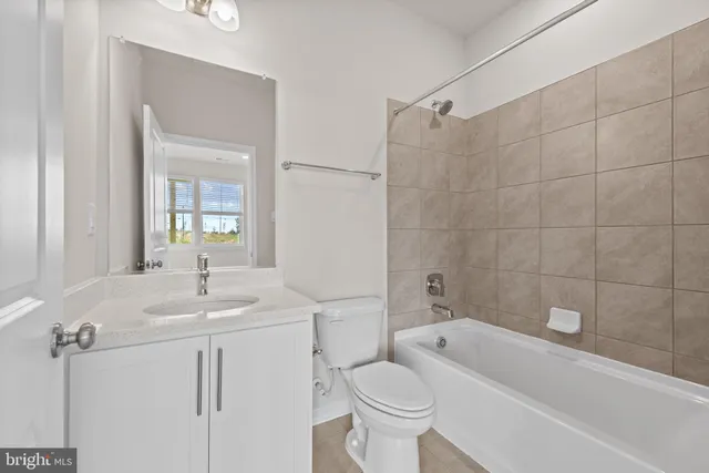 a bathroom with a sink toilet a shower and bathtub