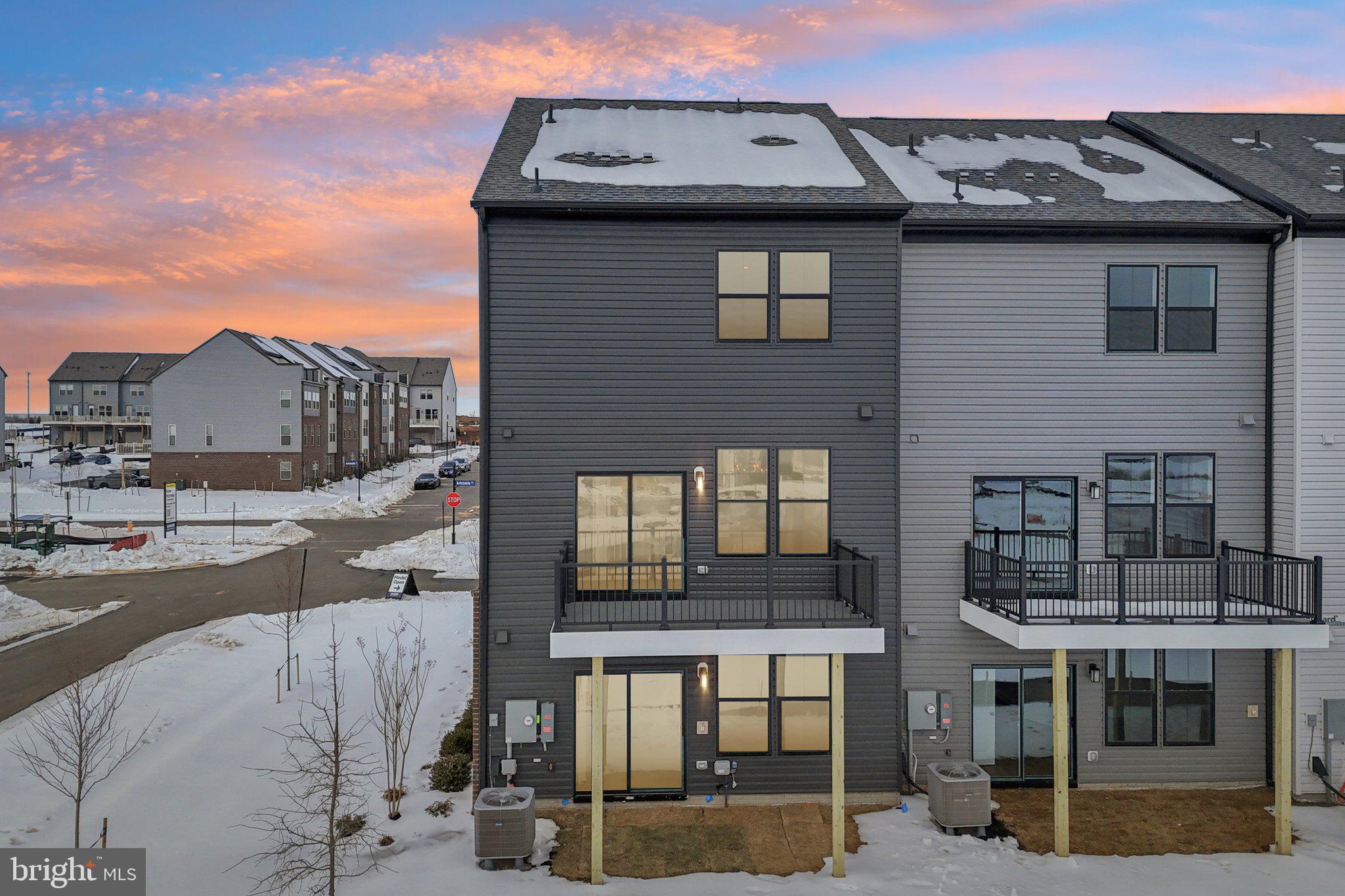 11361 Hypatia Loop Manassas, VA 20110 - Photo 54 of 55 a tall building with a outdoor space