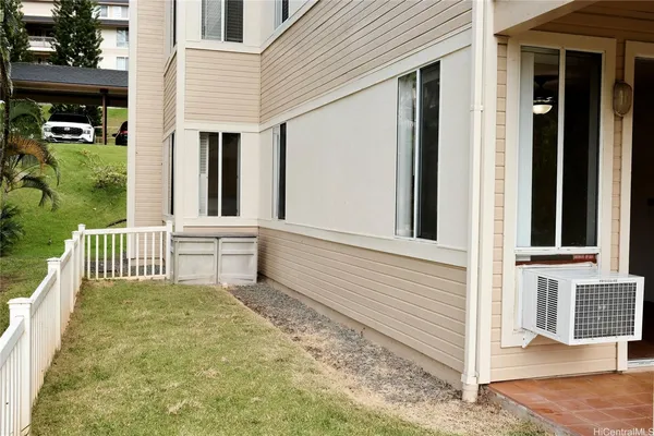 a view of a house with backyard and porch