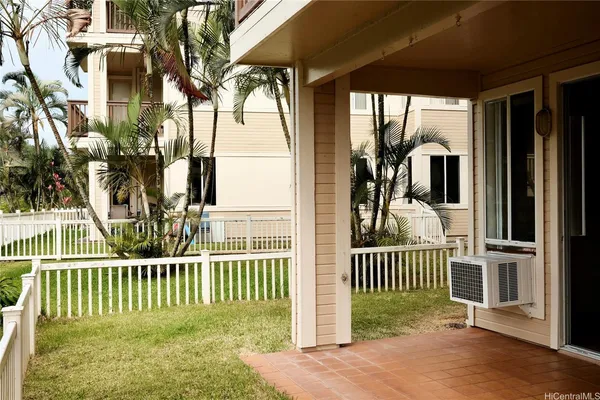 a view of a porch with a small yard