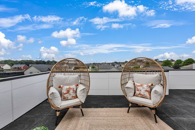 a view of a lake with outdoor seating