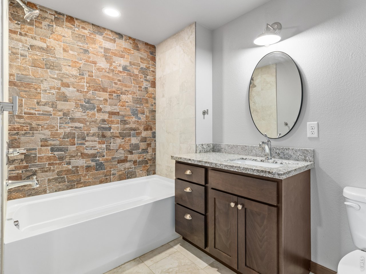 1836 Wildfire Road, Unit 203 Estes Park, CO 80517 - Photo 24 of 30 Guest bath with custom tile wall