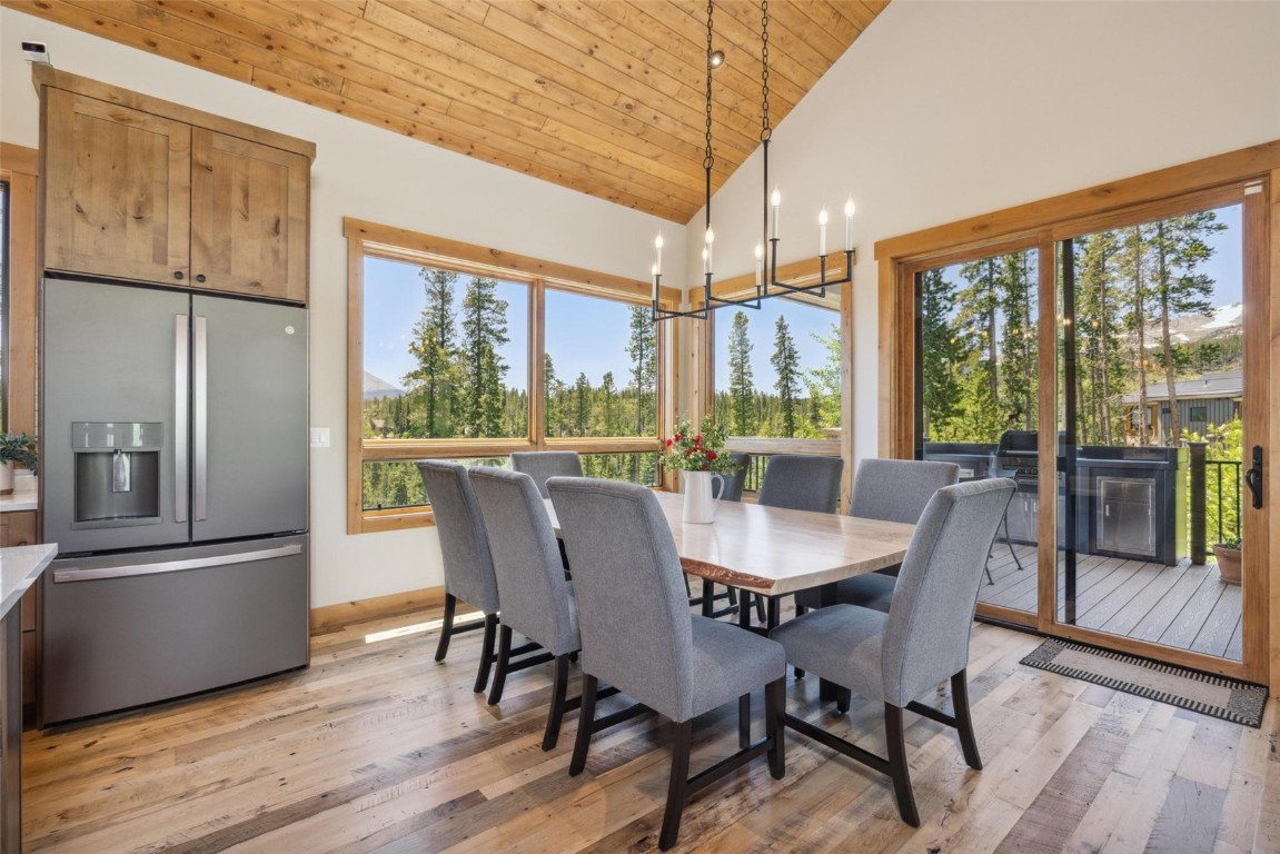 41 Barton Ridge Drive Breckenridge, CO 80424 - Photo 11 of 42 a dining room with furniture a chandelier and wooden floor