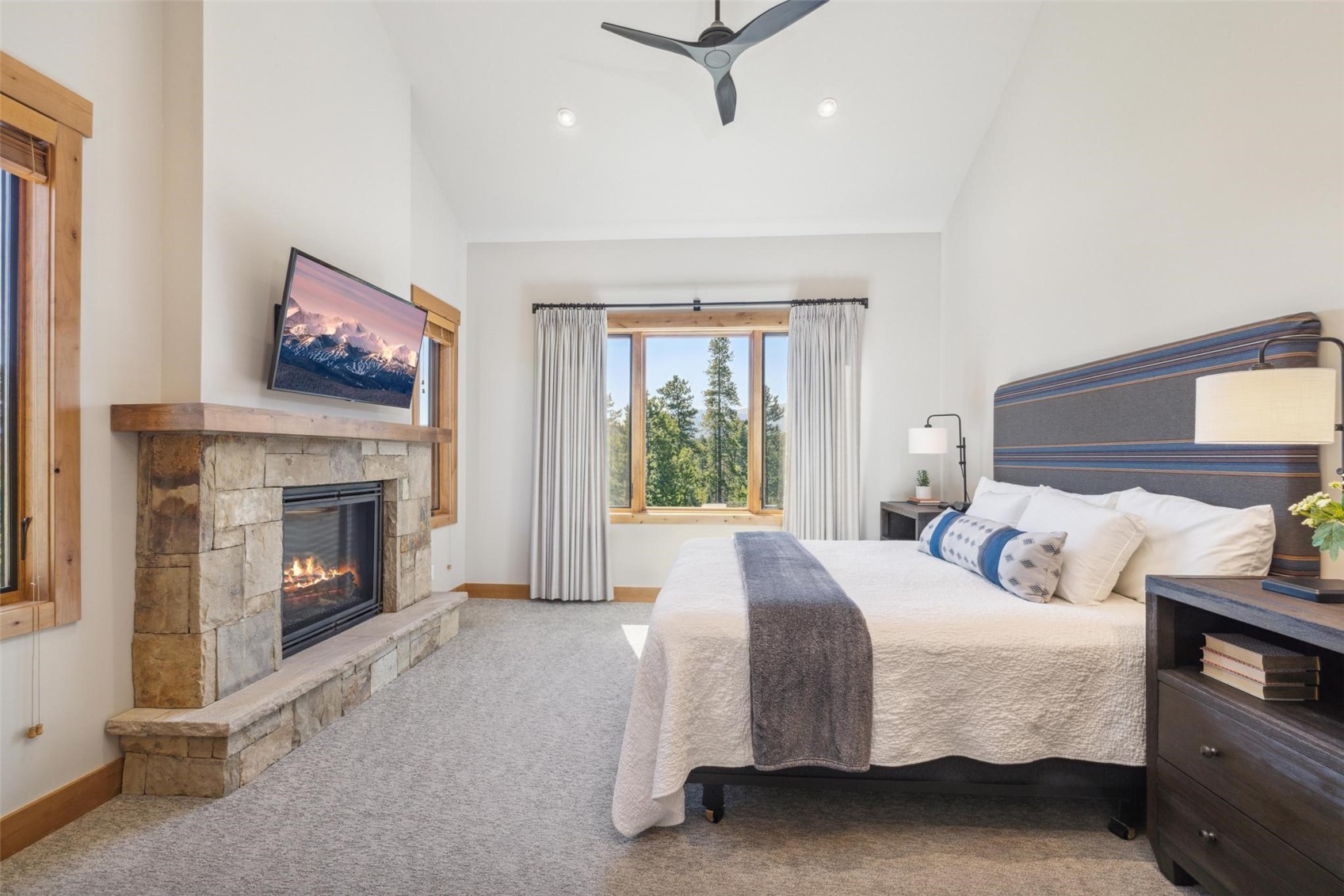 41 Barton Ridge Drive Breckenridge, CO 80424 - Photo 15 of 47 a bedroom with a bed and a fireplace