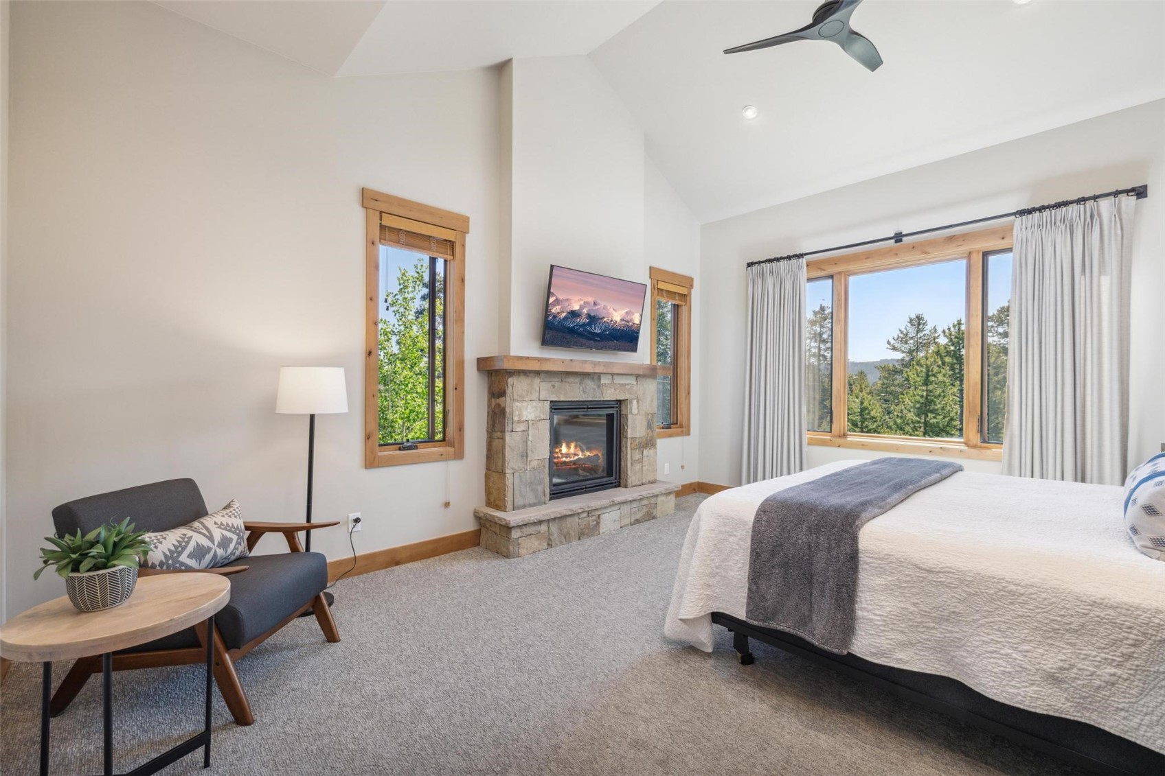 41 Barton Ridge Drive Breckenridge, CO 80424 - Photo 16 of 47 a spacious bedroom with a bed and a fireplace