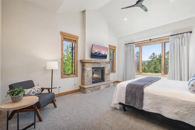 a bedroom with a bed and a book shelf