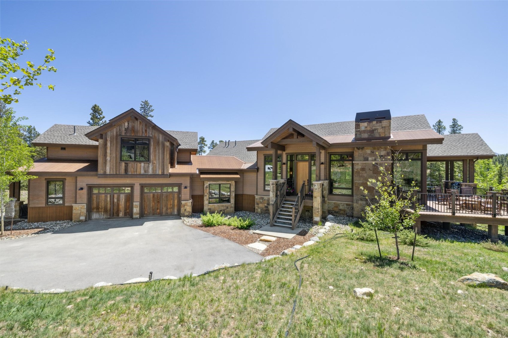 41 Barton Ridge Drive Breckenridge, CO 80424 - Photo 2 of 47 a front view of a house with a yard table and chairs