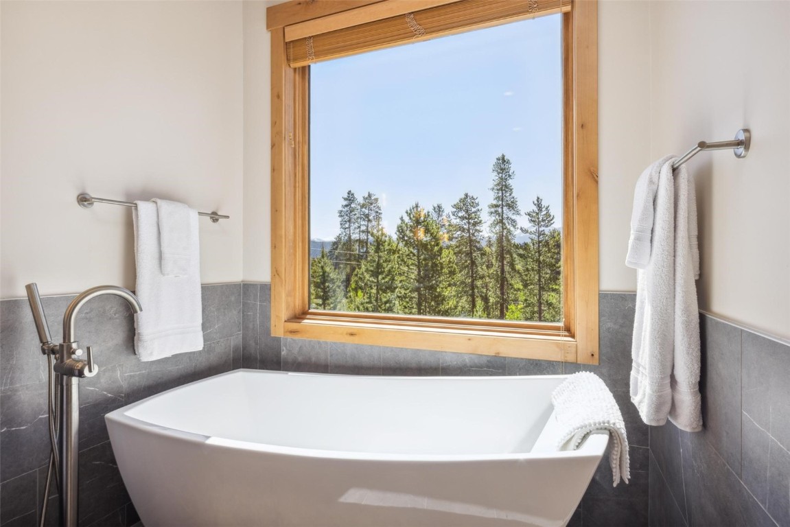 41 Barton Ridge Drive Breckenridge, CO 80424 - Photo 21 of 42 a white bath tub sitting next to a window