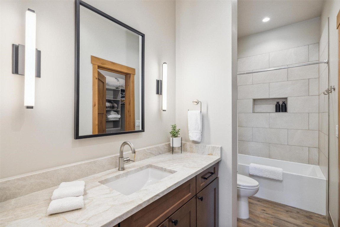 41 Barton Ridge Drive Breckenridge, CO 80424 - Photo 25 of 42 a bathroom with a granite countertop toilet sink and mirror