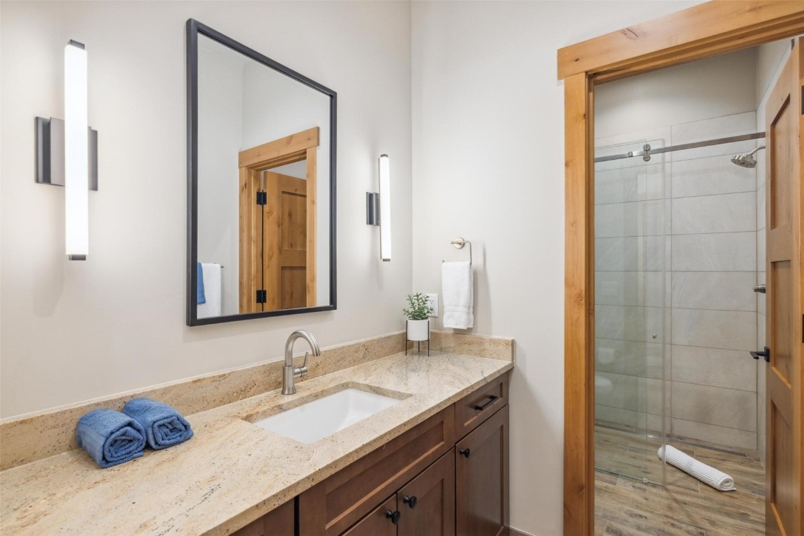 41 Barton Ridge Drive Breckenridge, CO 80424 - Photo 26 of 42 a bathroom with a granite countertop sink and a mirror