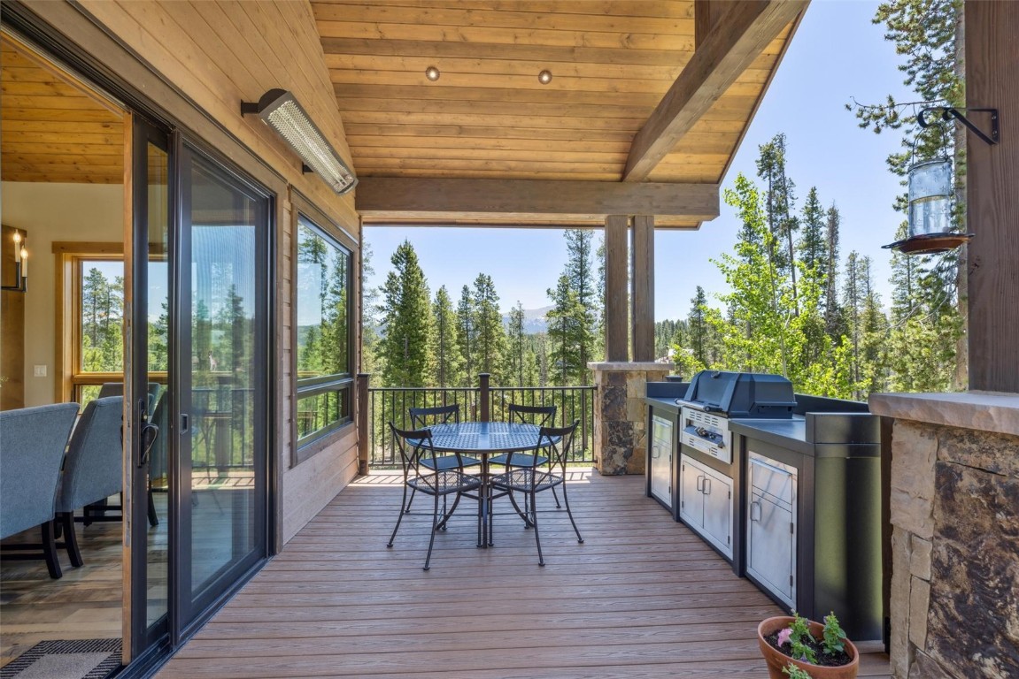41 Barton Ridge Drive Breckenridge, CO 80424 - Photo 28 of 42 a patio with wooden floor and outdoor seating