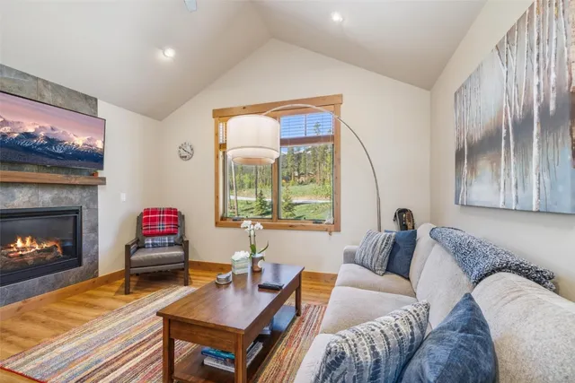 a kitchen with stainless steel appliances a sink a microwave a refrigerator and cabinets