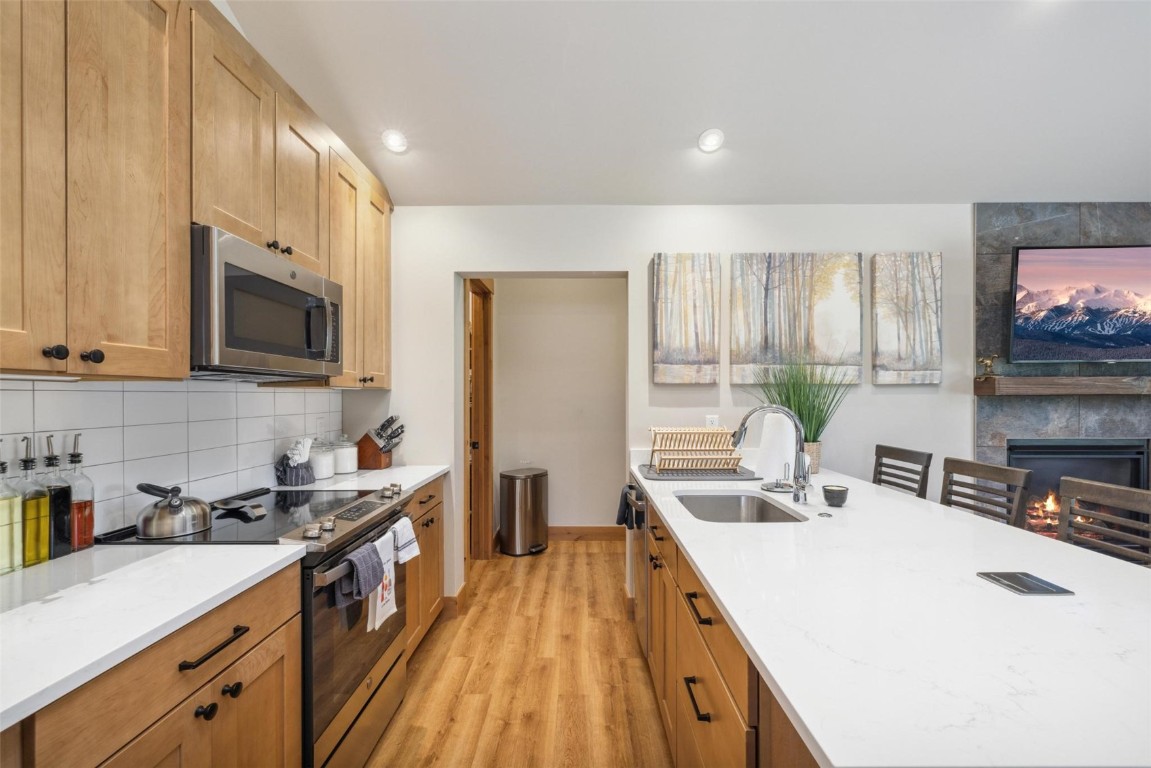 41 Barton Ridge Drive Breckenridge, CO 80424 - Photo 37 of 42 a kitchen with a sink a stove and cabinets