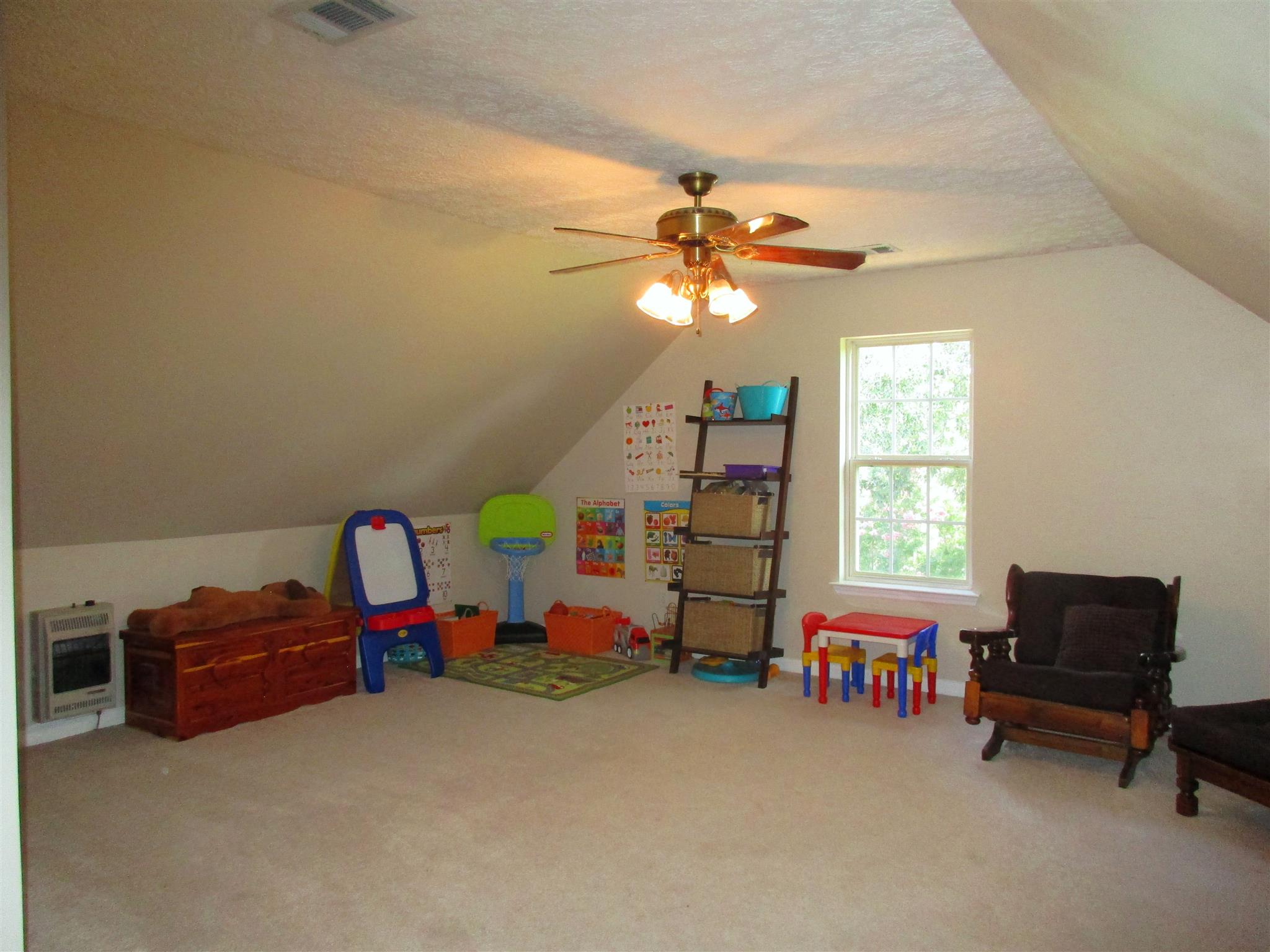 7515 Cherokee Hills Road Fairview, TN 37062 - Photo 15 of 23 a bedroom with furniture and a window