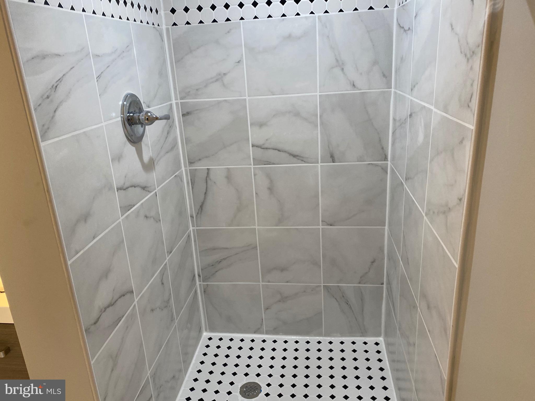 11706 Lytle Street Silver Spring, MD 20902 - Photo 56 of 67 NEW BATHROOM SHOWER FLOORING