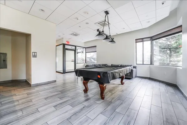 a living room with couch and a wooden floor