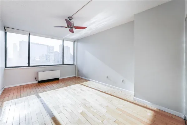 a view of an empty room with a window