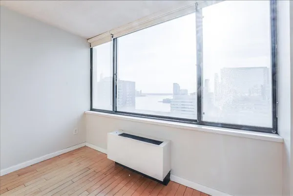 a room with a large window and outer view