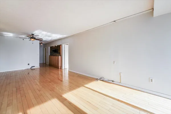 a view of a livingroom with wooden floor