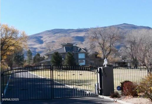 4180 Basque Lane Reno, NV 89519 - Photo 1 of 1 a view of a house with a snow in the background