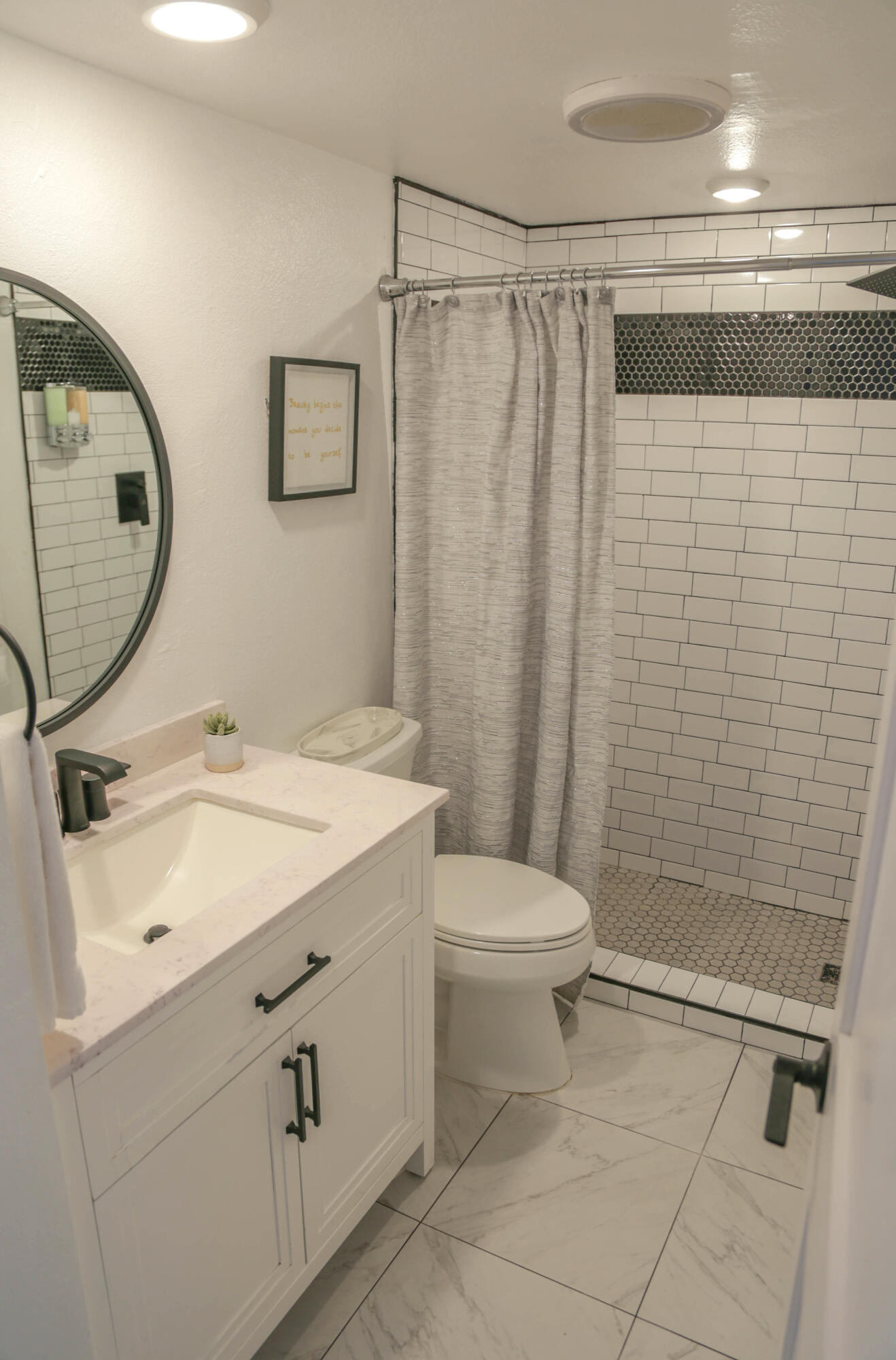 325 Ladera Street, Unit 5 Santa Barbara, CA 93101 - Photo 13 of 16 a bathroom with a sink toilet and shower