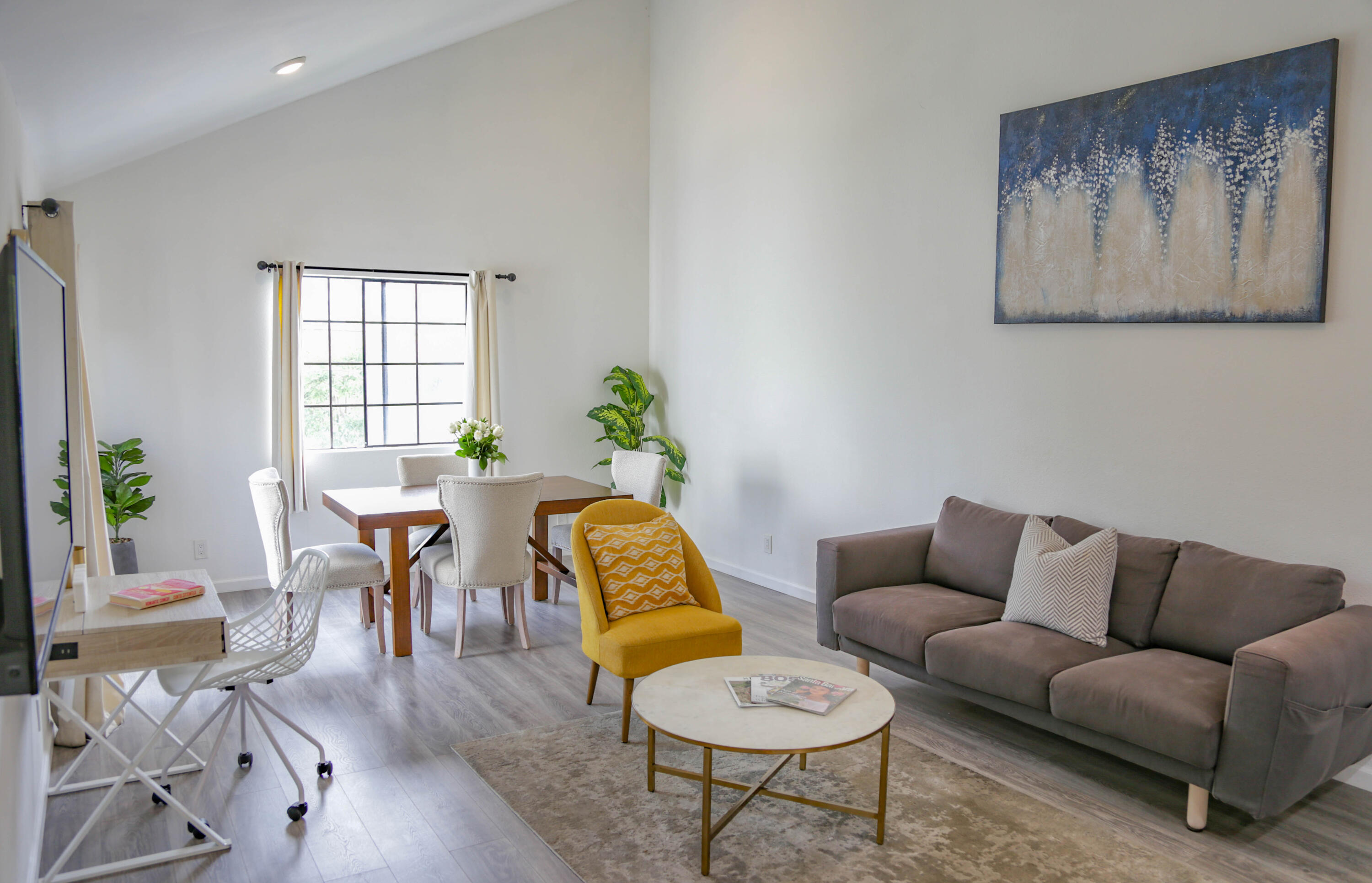 325 Ladera Street, Unit 5 Santa Barbara, CA 93101 - Photo 3 of 16 a living room with furniture and wooden floor