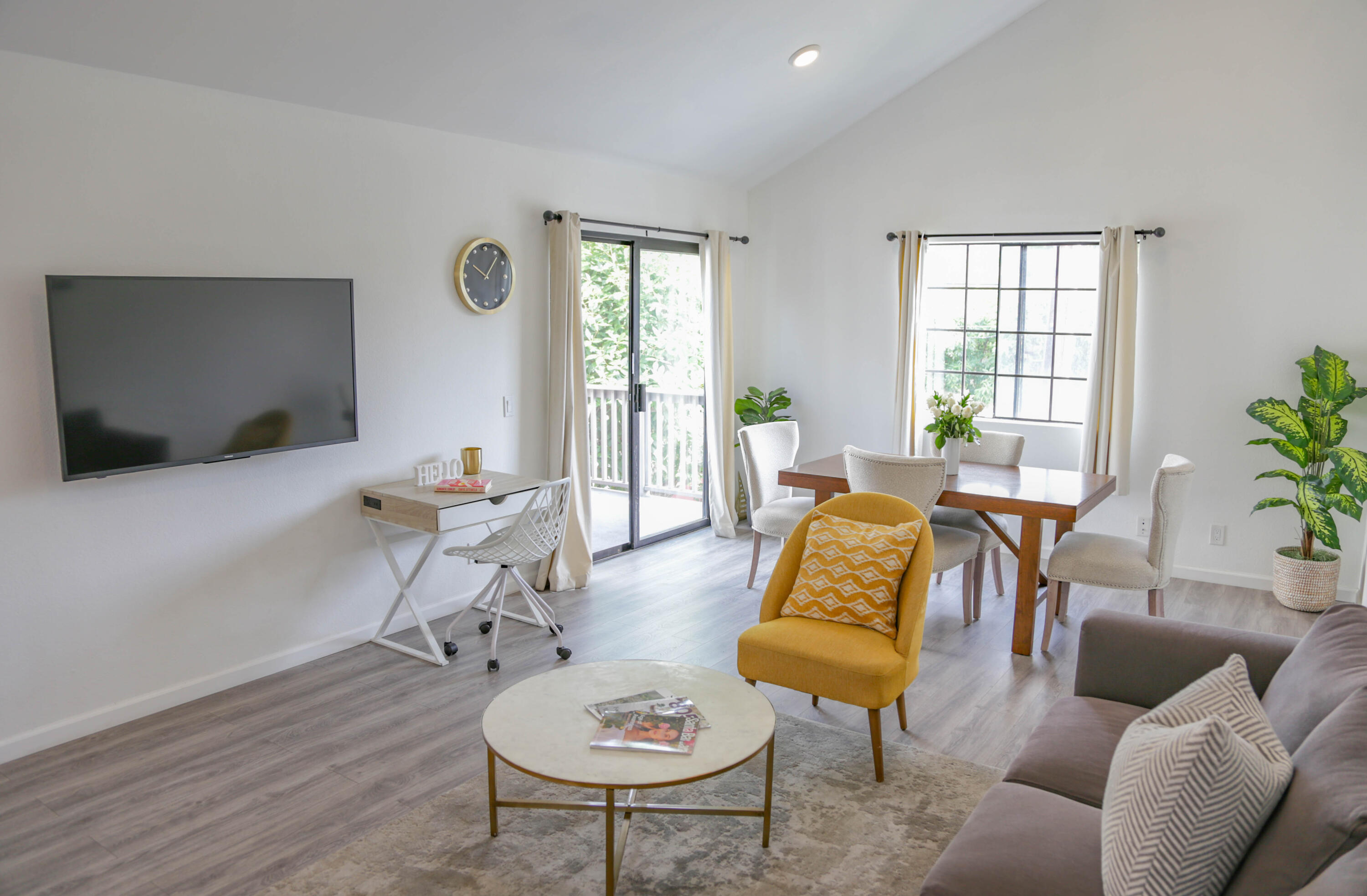 325 Ladera Street, Unit 5 Santa Barbara, CA 93101 - Photo 4 of 16 a living room with furniture and a flat screen tv