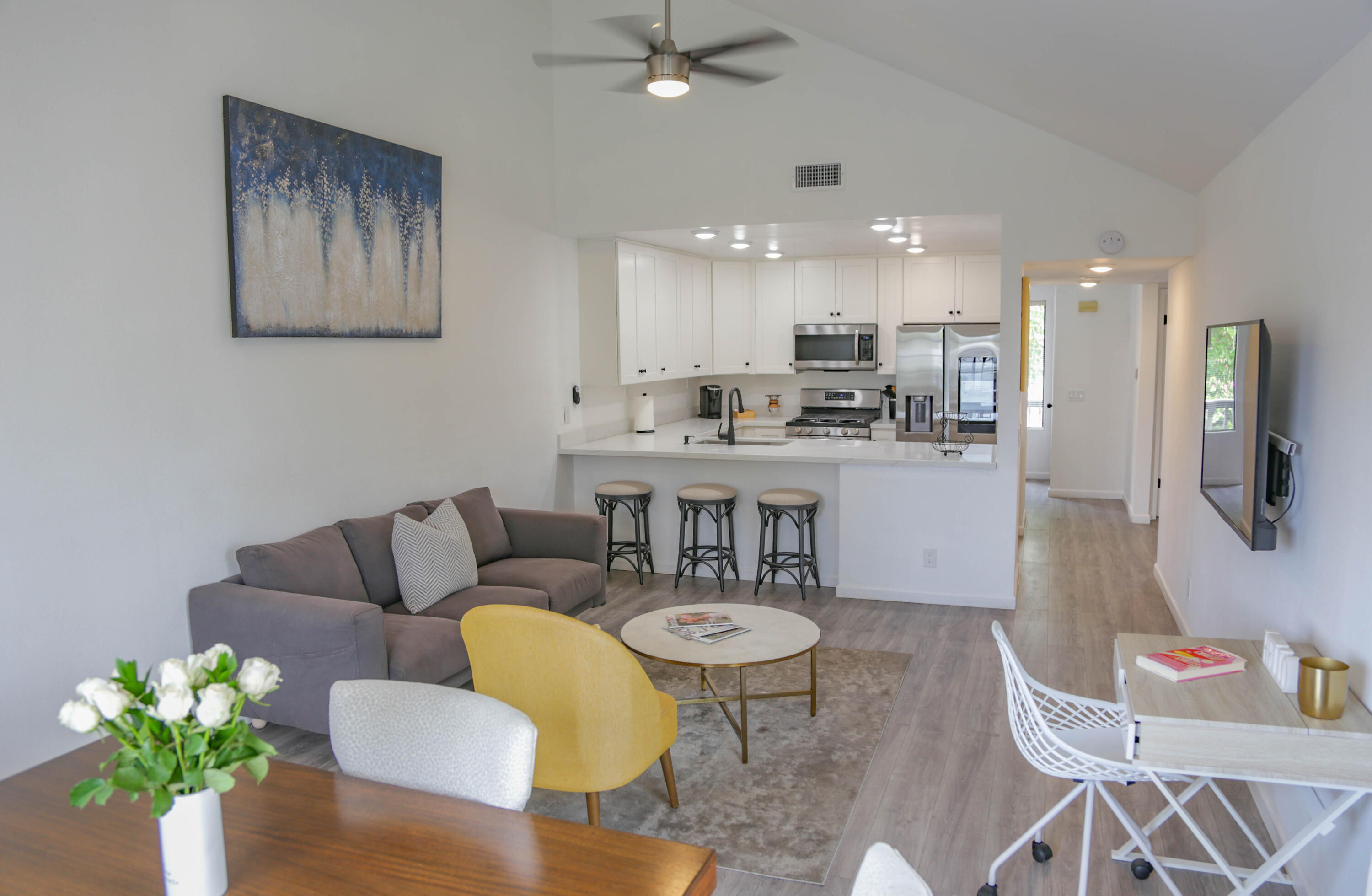 325 Ladera Street, Unit 5 Santa Barbara, CA 93101 - Photo 6 of 16 a living room with furniture and a dining table with kitchen view