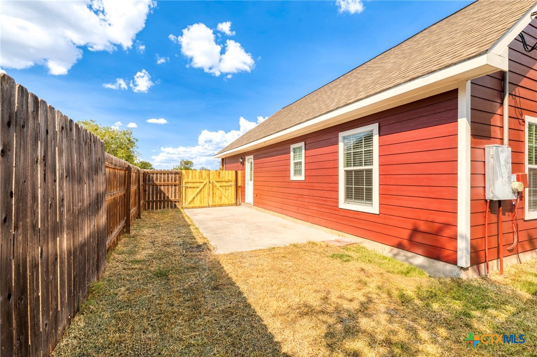1628 Armstrong Street Luling, TX 78648 - Photo 20 of 23 a view of a backyard with a garden