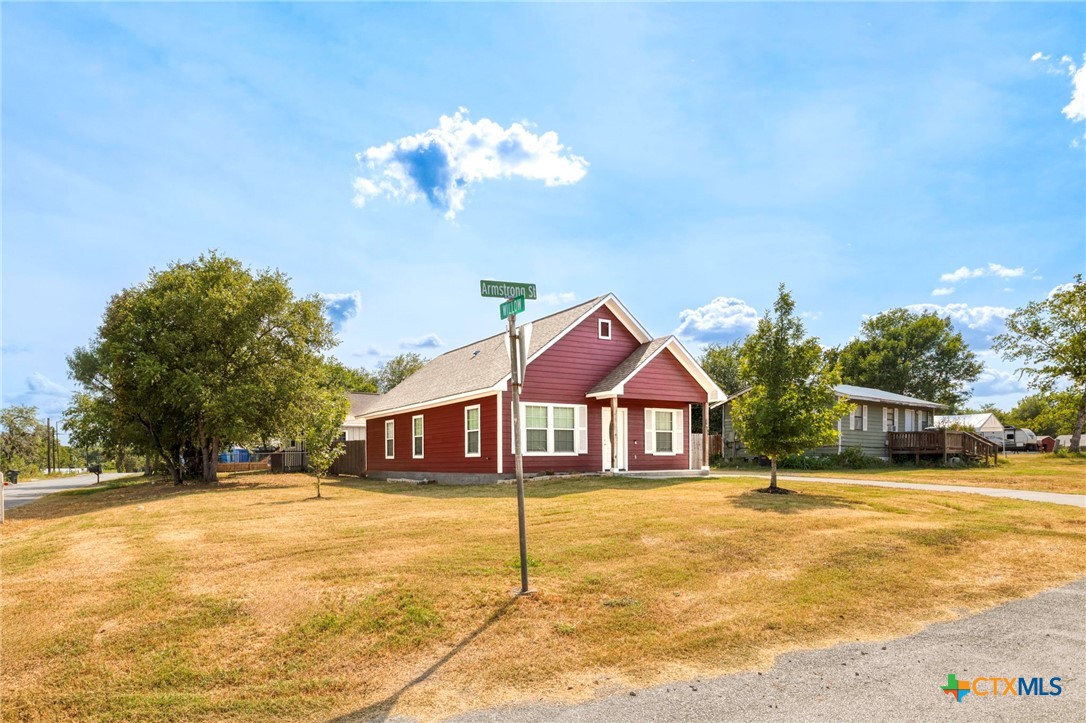 1628 Armstrong Street Luling, TX 78648 - Photo 2 of 23 a front view of a house with a yard
