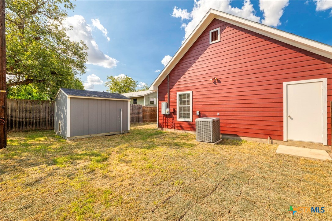 1628 Armstrong Street Luling, TX 78648 - Photo 21 of 23 a view of a house with a yard and garage