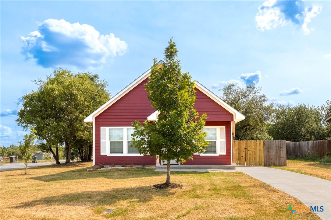 1628 Armstrong Street Luling, TX 78648 - Photo 3 of 23 a view of a house with a patio and a yard