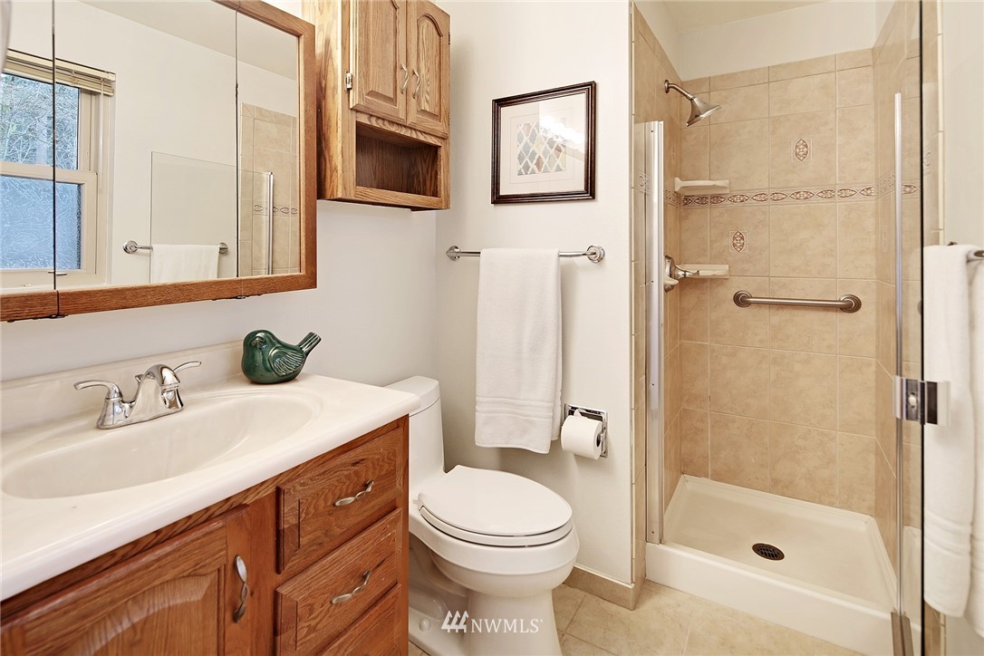 22605 1st Drive Southeast Bothell, WA 98021 - Photo 14 of 27 a bathroom with a sink a toilet and shower