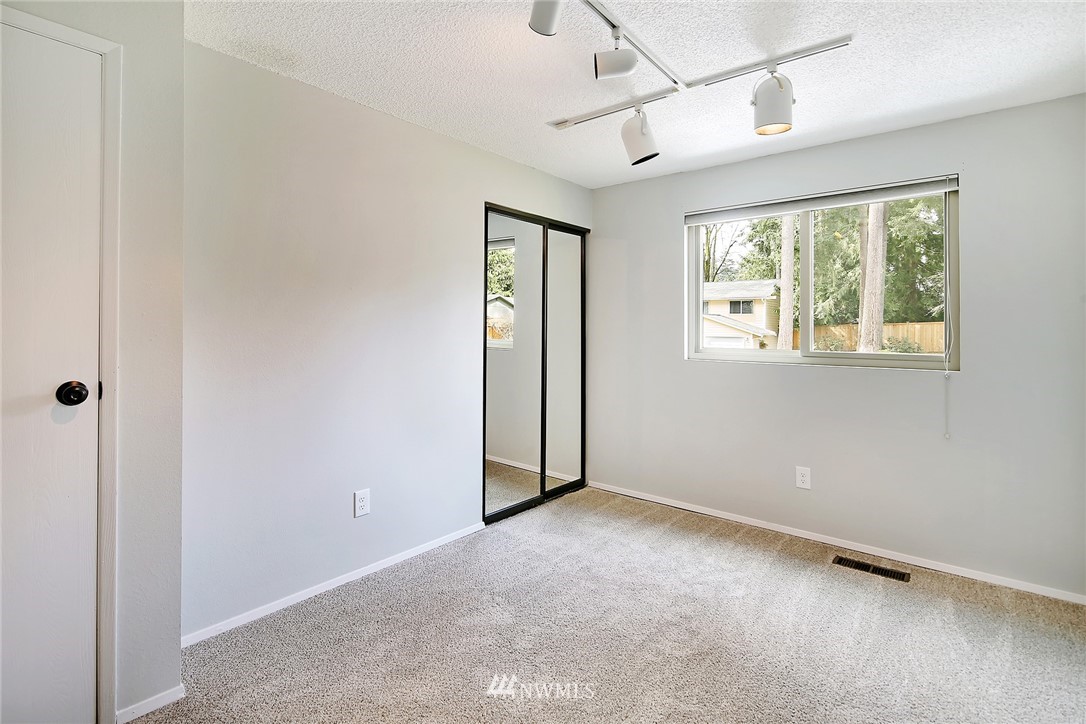 22605 1st Drive Southeast Bothell, WA 98021 - Photo 17 of 27 a view of an empty room with a window