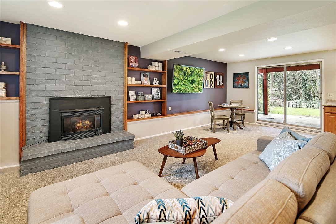 22605 1st Drive Southeast Bothell, WA 98021 - Photo 19 of 27 a living room with furniture and a fireplace