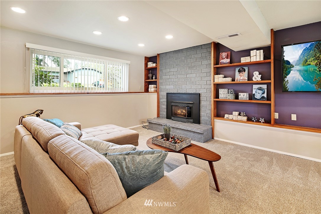 22605 1st Drive Southeast Bothell, WA 98021 - Photo 20 of 27 a living room with furniture and a fireplace