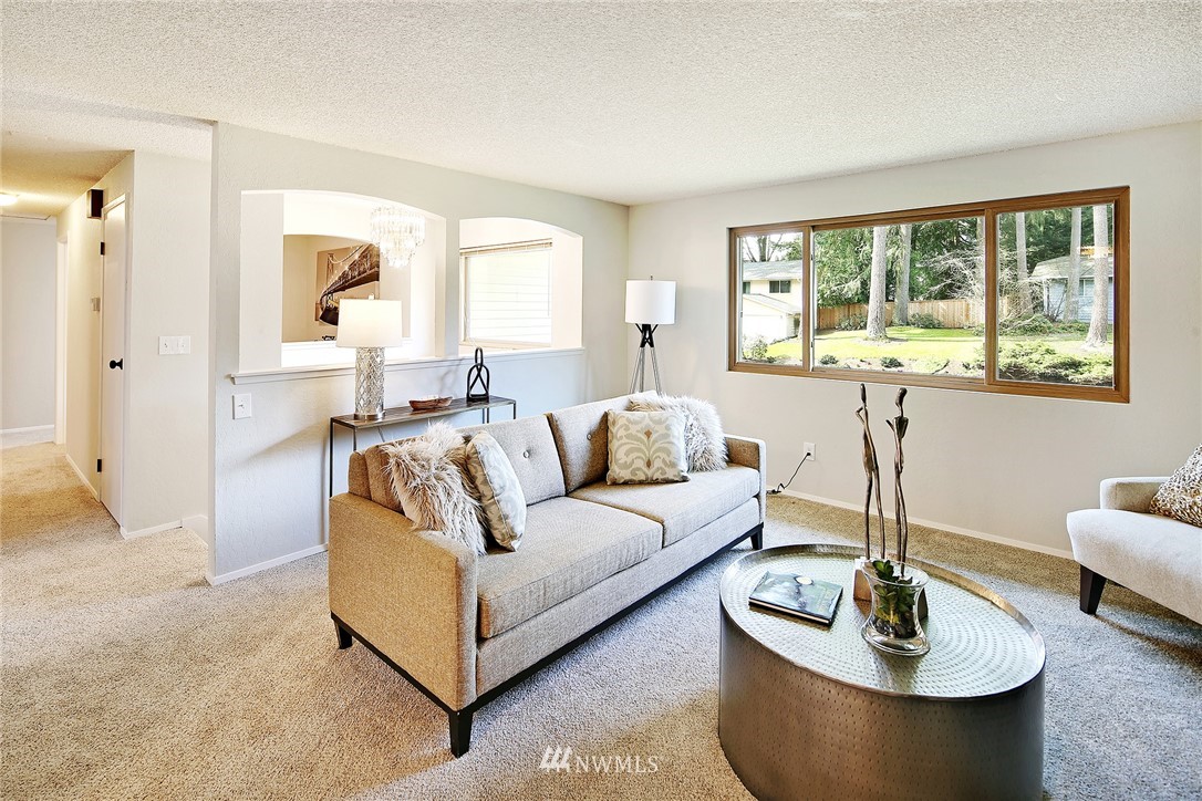22605 1st Drive Southeast Bothell, WA 98021 - Photo 3 of 27 a living room with furniture and a large window