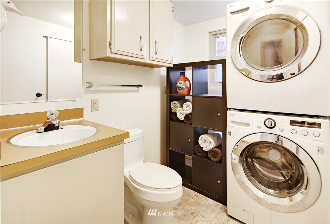 22605 1st Drive Southeast Bothell, WA 98021 - Photo 22 of 27 a bathroom with a sink a toilet and a mirror