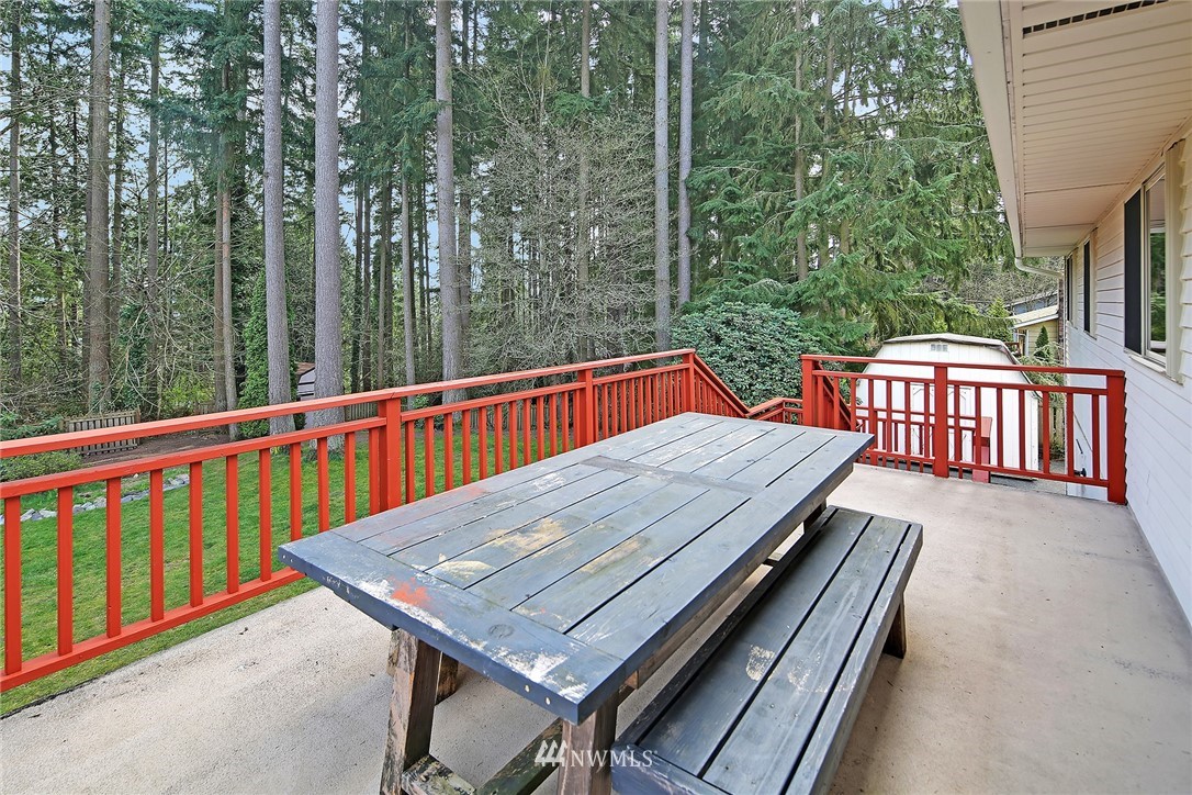 22605 1st Drive Southeast Bothell, WA 98021 - Photo 23 of 27 a view of a balcony with wooden floor and outdoor seating