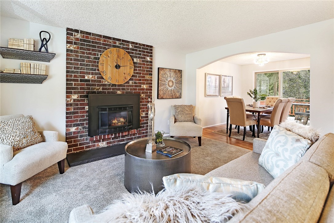 22605 1st Drive Southeast Bothell, WA 98021 - Photo 5 of 27 a living room with furniture a fireplace and a large window