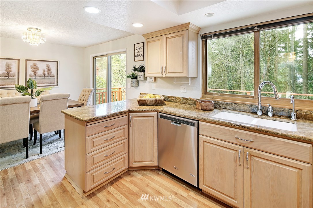 22605 1st Drive Southeast Bothell, WA 98021 - Photo 7 of 27 a kitchen with a sink stove and cabinets